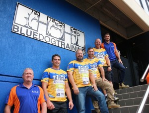 The team at Blue Dog Training features Norths player Chris Porter, former Tigers greats Brad Deas and Kerry Theuerkauf, and brother of Brent Newton, Tim. 